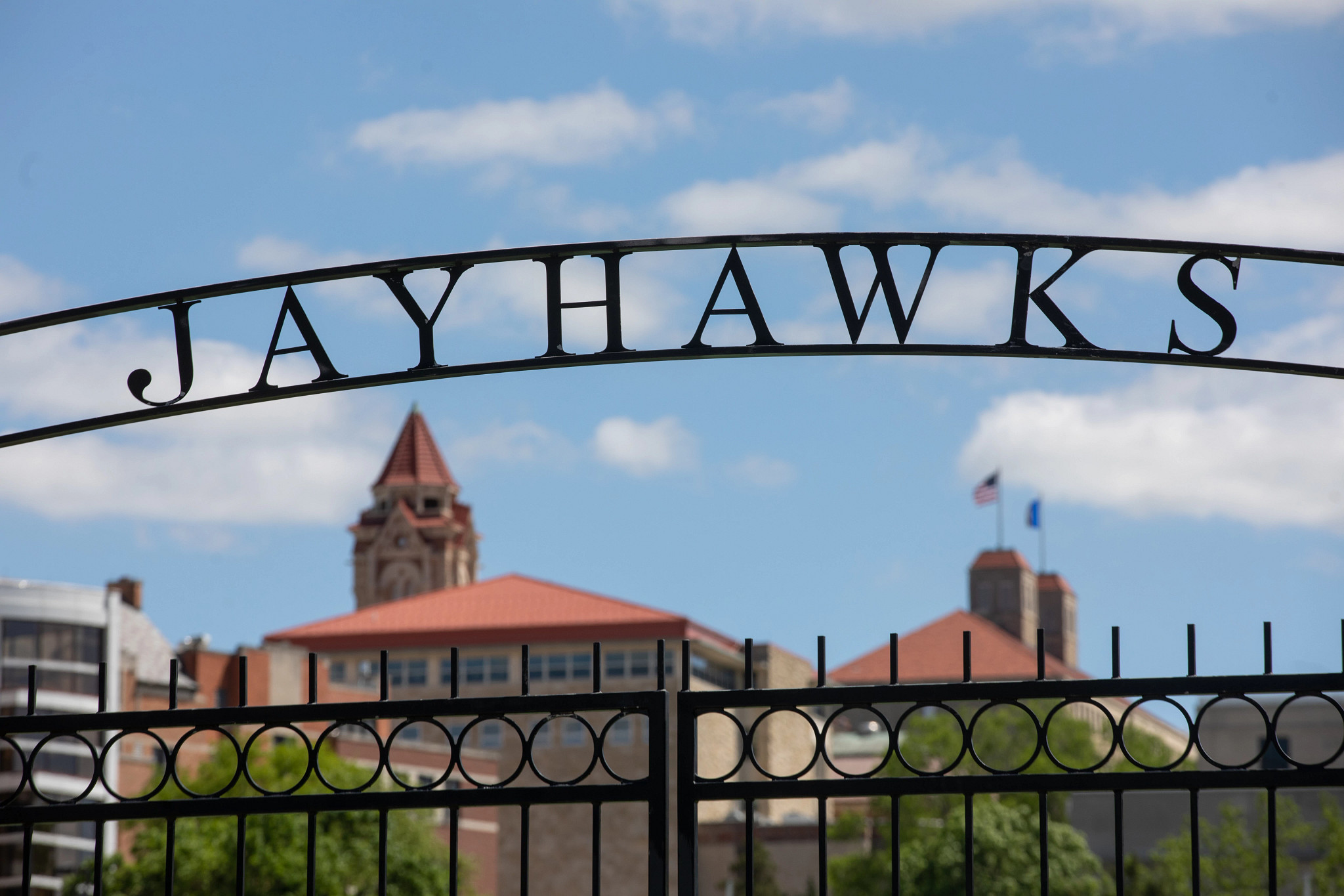 Jayahwks text on an iron fence